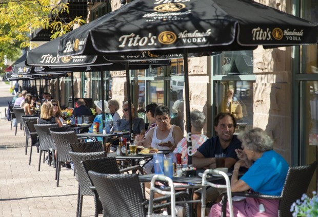 Diners eat outside Peggy Kinnane''s in downtown Arlington Heights on...