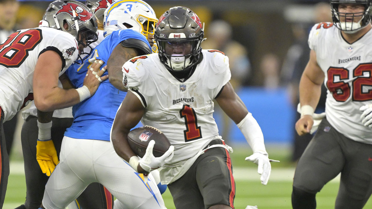Tampa Bay Buccaneers running back Rachaad White (1) carries the ball for a 7-yard gain in the second half against the Los Angeles Chargers at SoFi Stadium. 