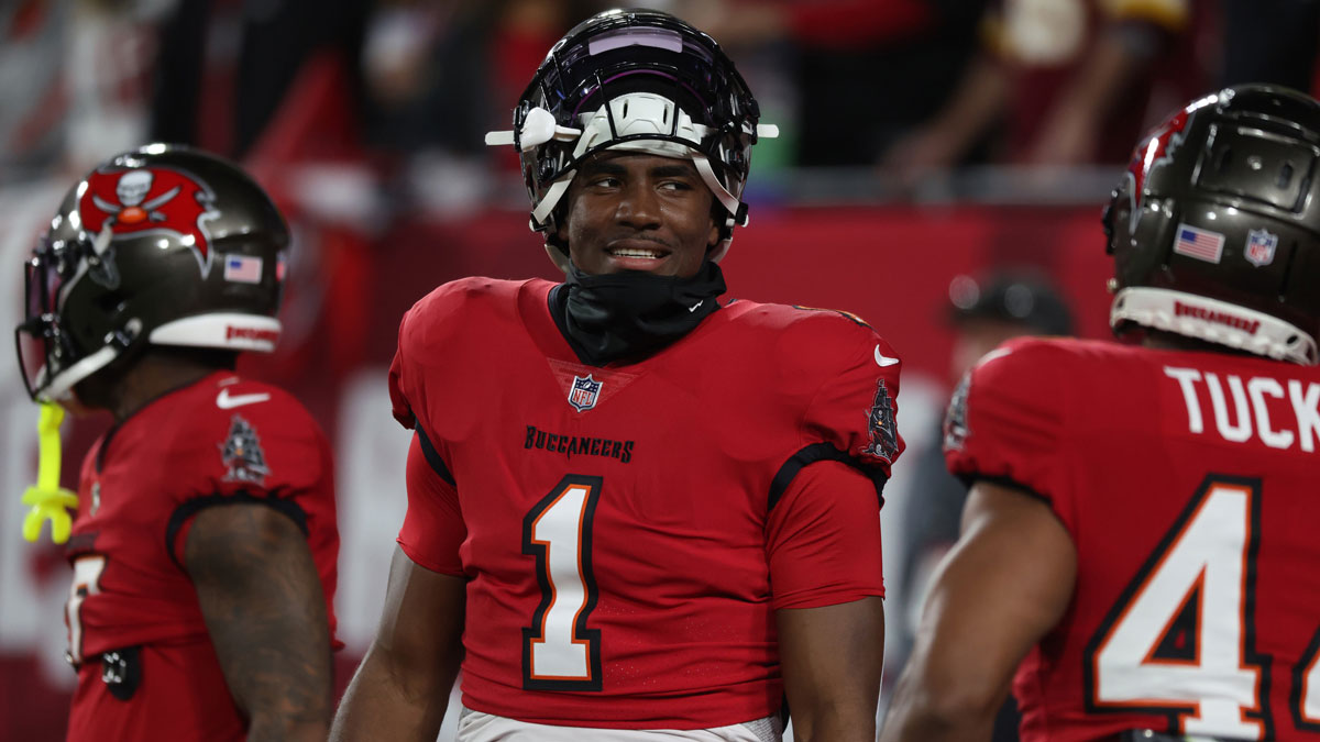 Tampa Bay Buccaneers running back Rachaad White (1) warms up before a NFC wild card playoff against the Washington Commanders at Raymond James Stadium.