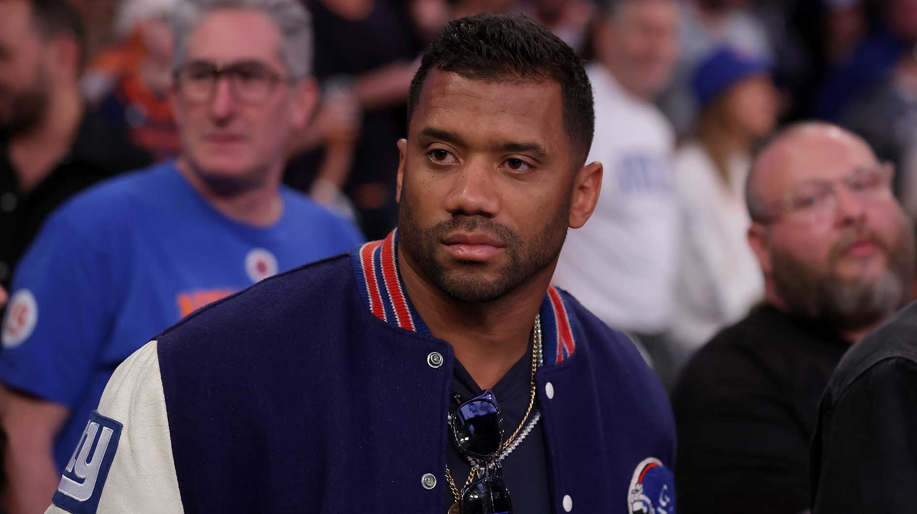 New York Giants quarterback Russell Wilson stands courtside during the fourth quarter of game six in the second round of the 2025 NBA Playoffs between the New York Knicks and the Boston Celtics at Madison Square Garden.