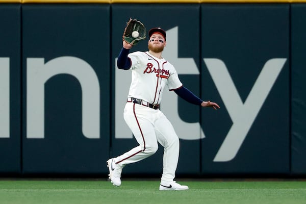 Braves outfielder Alex Verdugo catches a fly ball in the ninth inning of Wednesday's loss to the Reds.