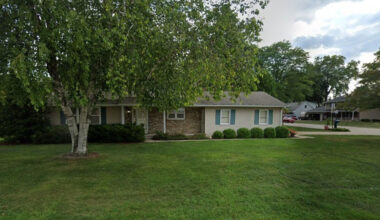 Modest house sells for $800,000 and overpriced by $600,000 with iconic sport stadium sitting next door