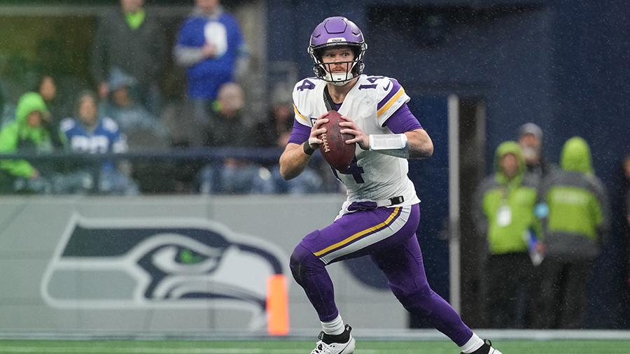 Seattle Seahawks Sam Darnold rolling out Minnesota Vikings 2024...