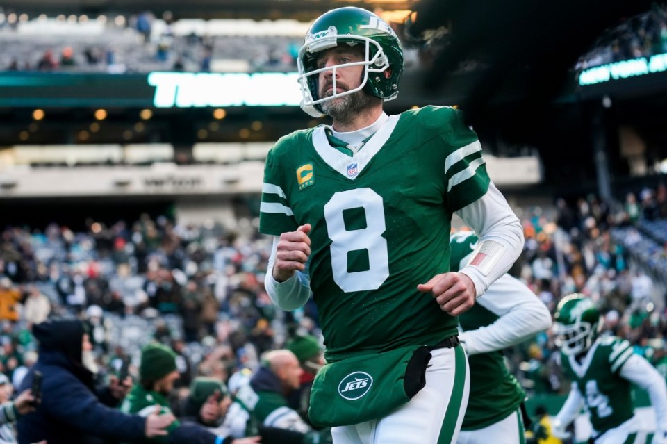 FILE - New York Jets quarterback Aaron Rodgers runs onto the field before an NFL football game against the Miami Dolphins, Sunday, Jan. 5, 2025, in East Rutherford, N.J. (AP Photo/Seth Wenig, File)