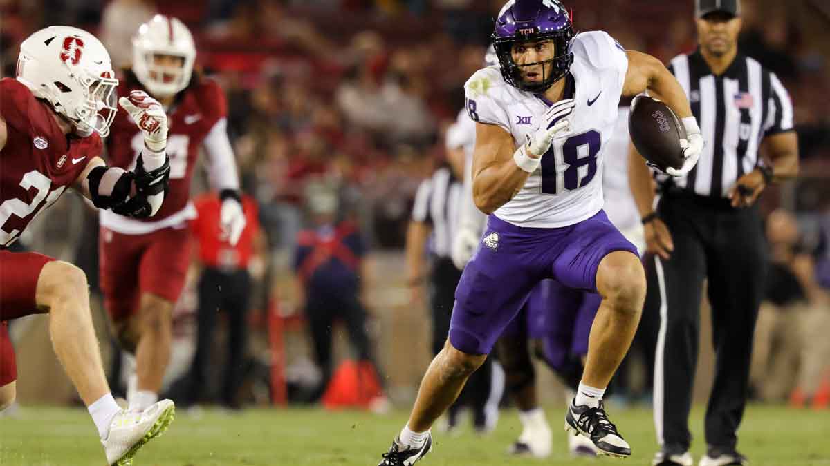 TCU Horned Frogs wide receiver Jack Bech (18) runs with the ball past Stanford Cardinal safety Scotty Edwards (21) during the second half at Stanford Stadium.