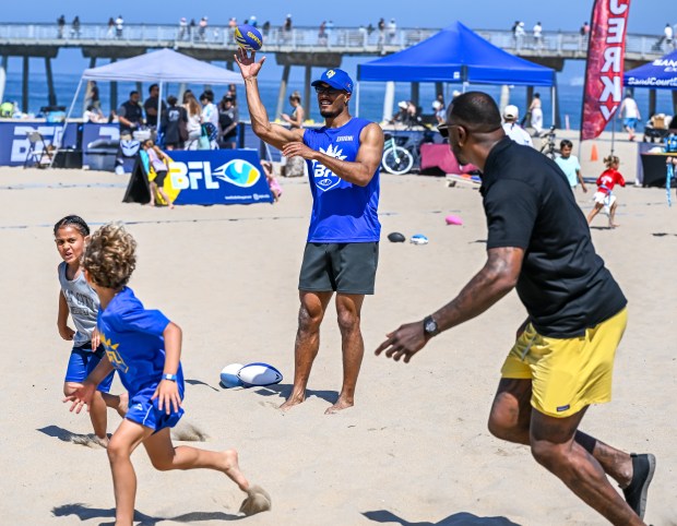 Super Bowl champion Malik Jackson (right) and Los Angeles Rams...