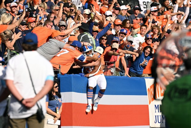 Denver Broncos running back Jaleel McLaughlin celebrates his third quarter touchdown with fans during a game at Empower Field at Mile High in Denver, on Oct. 6, 2024. (Photo by Helen H. Richardson/The Denver Post)