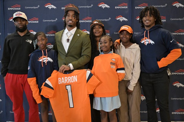 Texas defensive back Jahdae Barron (7) wears the Golden Hat Trophy as he celebrates the team's win against Oklahoma with fans after an NCAA college football game in Dallas, Saturday, Oct. 12, 2024. (AP Photo/Jeffrey McWhorter)