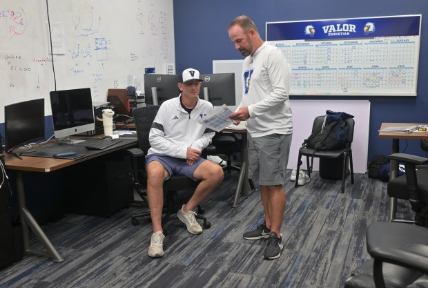 AURORA, CO - MARCH 26: Valor Christian Head Coach Keith Wahl greets his players as they head off the field to the bench at Regis Jesuit High School on March 26, 2022 in Aurora, Colorado. (Photo By Kathryn Scott/Special to The Denver Post)