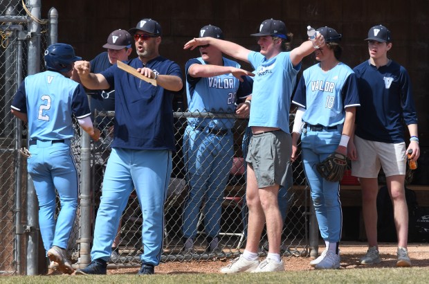 AURORA, CO - MARCH 26: Valor Christian Head Coach Keith Wahl greets his players as they head off the field to the bench at Regis Jesuit High School on March 26, 2022 in Aurora, Colorado. (Photo By Kathryn Scott/Special to The Denver Post)