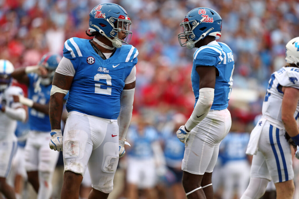 Mississippi Rebels defensive linemen Walter Nolen (2) and linebacker Suntarine Perkins (4) react after a sack during the second half against the Kentucky Wildcats at Vaught-Hemingway Stadium.