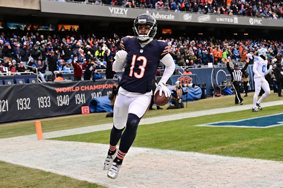 Chicago Bears wide receiver Keenan Allen (13) reacts after a touchdown reception against the Detroit Lions during the second quarter at Soldier Field.© Daniel Bartel-Imagn Images