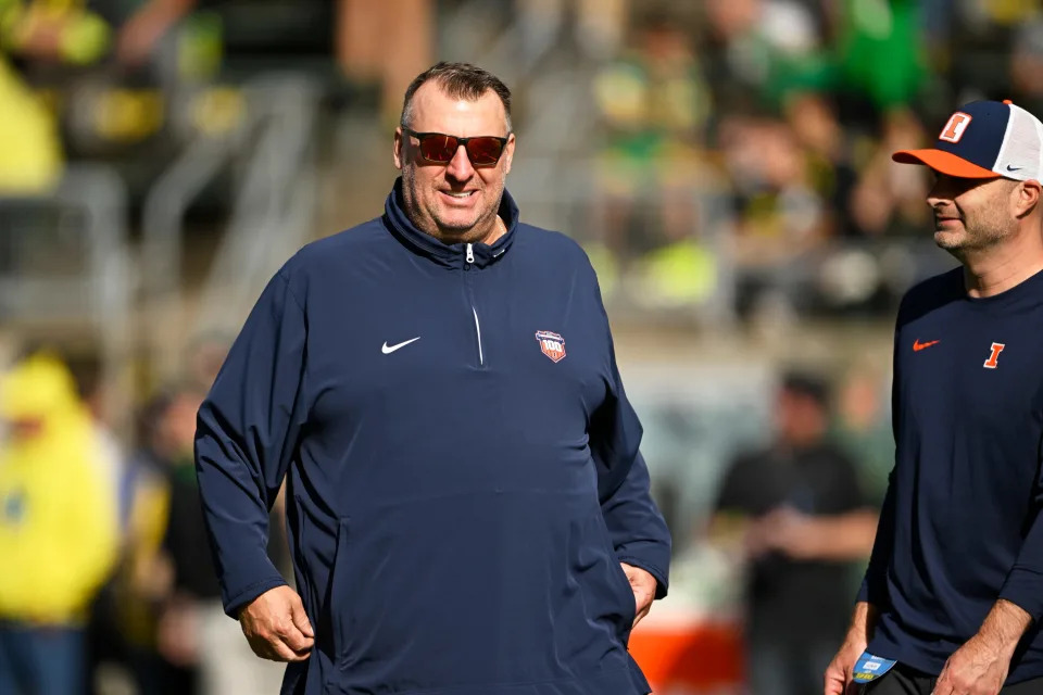 Oct 26, 2024; Eugene, Oregon, USA; Illinois Fighting Illini head coach Bret Bielema watches players warm up before a game against the Oregon Ducks at Autzen Stadium. Mandatory Credit: Troy Wayrynen-Imagn Images