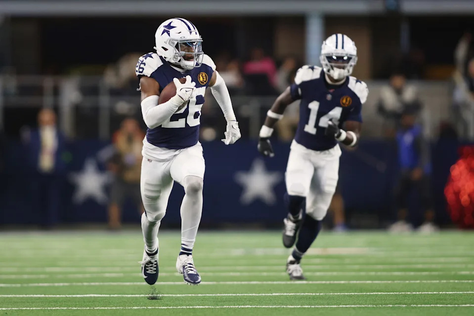 Nov 23, 2023; Arlington, Texas, USA; Dallas Cowboys cornerback DaRon Bland (26) returns an interception for a touchdown in the fourth quarter against the Washington Commanders at AT&T Stadium. Mandatory Credit: Tim Heitman-USA TODAY Sports