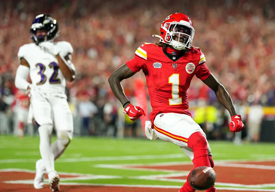Kansas City Chiefs wide receiver Xavier Worthy (1) scores a touchdown against Baltimore Ravens safety Marcus Williams (32) during the first half.Jay Biggerstaff-Imagn Images