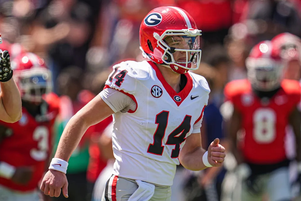 Georgia Bulldogs quarterback Gunner Stockton (14) runs on the field prior to the start of the Georgia Spring game at Sanford Stadium.