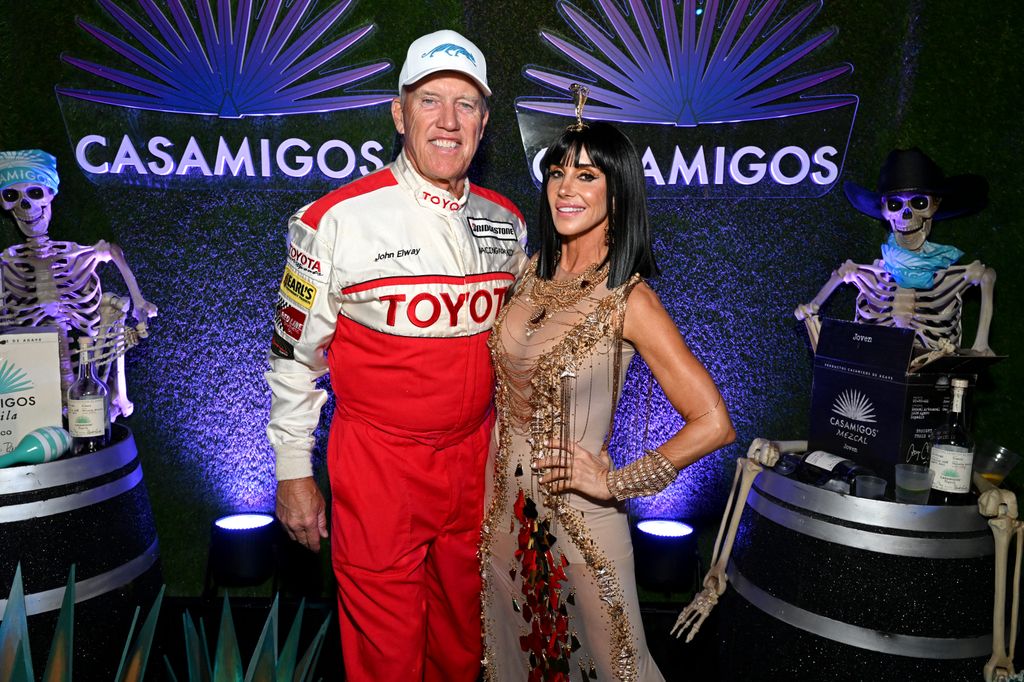 John Elway and Paige Elway attend the Casamigos Halloween Party Returns in Beverly Hills on October 28, 2022 in Beverly Hills, California