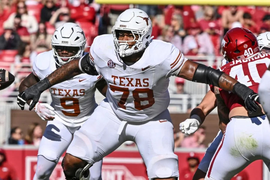 Texas offensive lineman Kelvin Banks Jr. (78) sets up to block against Arkansas during the first half of an NCAA college football game Saturday, Nov. 16, 2024, in Fayetteville, Ark. (AP Photo/Michael Woods)