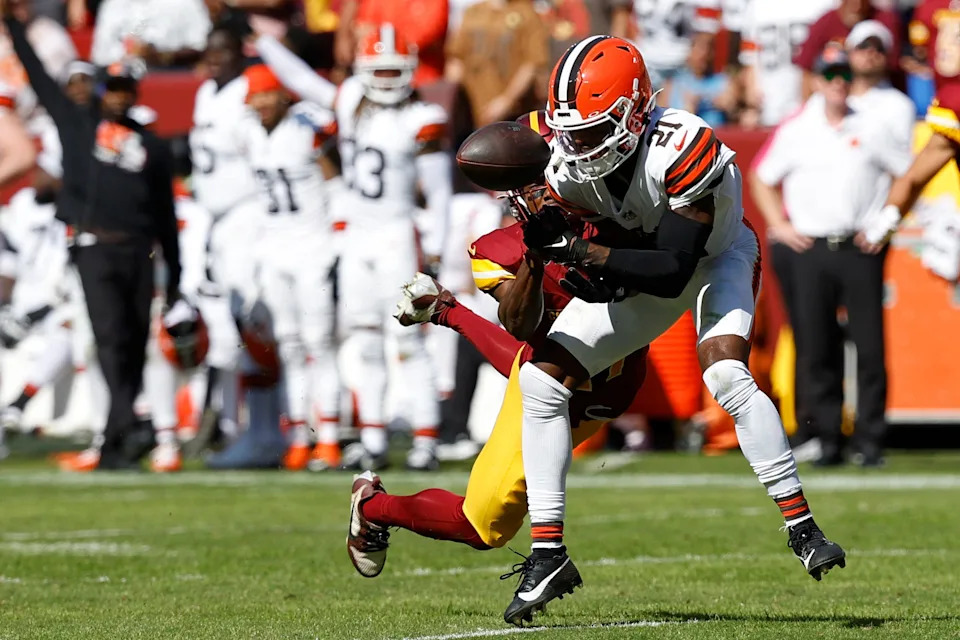 Oct 6, 2024; Landover, Maryland, USA; Cleveland Browns cornerback Denzel Ward (21) breaks up a pass intended for Washington Commanders wide receiver Terry McLaurin (17) during the second quarter at NorthWest Stadium. Mandatory Credit: Geoff Burke-Imagn Images