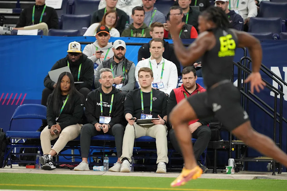 NFL scouts time Texas defensive lineman Barryn Sorrell in the 40-yard dash during the NFL scouting combine on Feb. 27 at Lucas Oil Stadium in Indianapolis, Ind. Sorrell was drafted in the fourth round by the Green Bay Packers, one of 12 Longhorns taken in this year's draft.