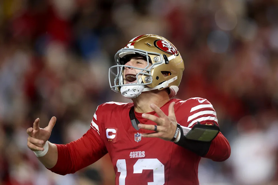 SANTA CLARA, CALIFORNIA - DECEMBER 30: Brock Purdy #13 of the San Francisco 49ers reacts after he ran the ball in for a touchdown against the Detroit Lions at Levi's Stadium on December 30, 2024 in Santa Clara, California. (Photo by Ezra Shaw/Getty Images)