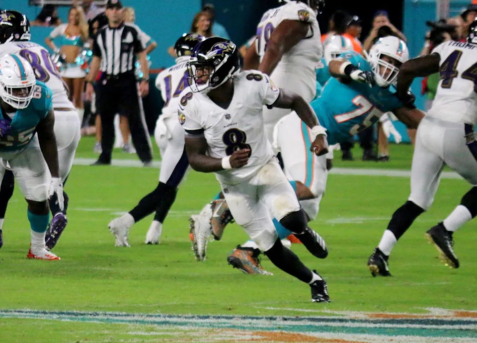 Baltimore Ravens playing a football game against the Miami Dolphins.