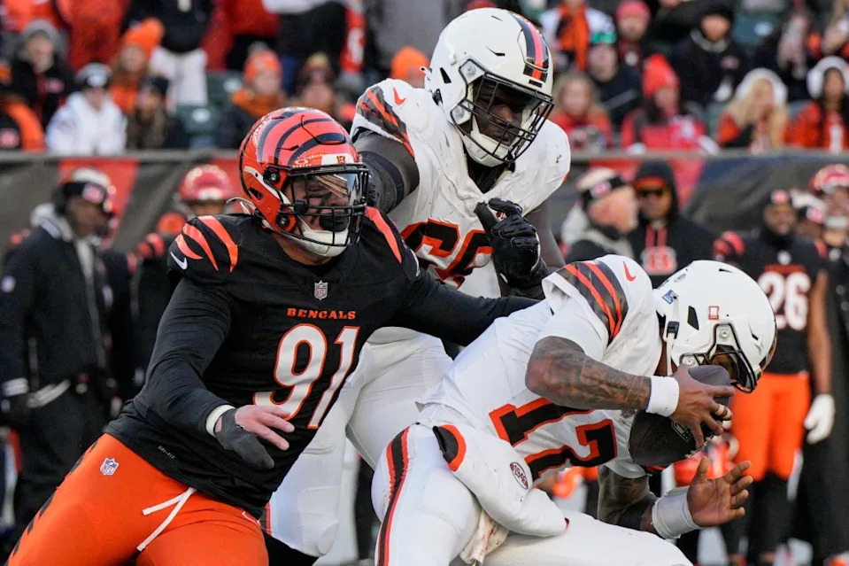 Cleveland Browns quarterback Dorian Thompson-Robinson (17) is pressured by Cincinnati Bengals defensive end Trey Hendrickson (91) during a game on December 22, 2024, in Cincinnati. AP