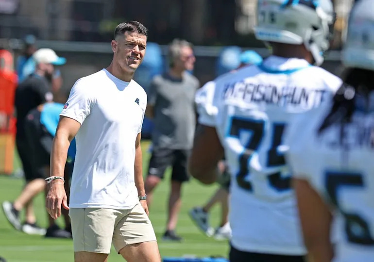 Carolina Panthers head coach Dave Canales walks around the field watching players run through stretching drills during the team’s rookie minicamp practice on Friday, May 9, 2025. JEFF SINER/jsiner@charlotteobserver.com