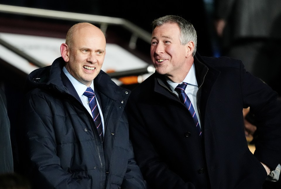 Rangers CEO and chairman in the stands at a football match.
