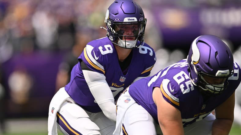 J.J. McCarthy and Michael Jurgens practice snaps during pregame warmups at U.S. Bank Stadium.
