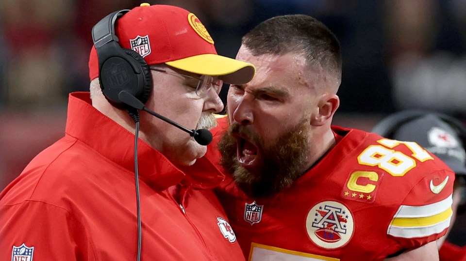 Travis Kelce of the Kansas City Chiefs reacts to Head Coach Andy Reid during Super Bowl LVIII.