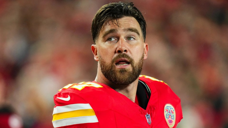 Travis Kelce #87 of the Kansas City Chiefs on the sideline.