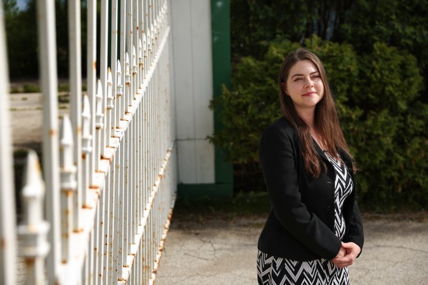 Rolling Meadows mayor Lara Sanoica near the white iron gates by west entrance of the former Arlington International Racecourse off of Rohlwing Road on May 27, 2025, in Rolling Meadows. Rolling Meadows borders three sides of the property. Sanoica, a life long resident of Rolling Meadows, has been the mayor since 2023. (Stacey Wescott/Chicago Tribune)