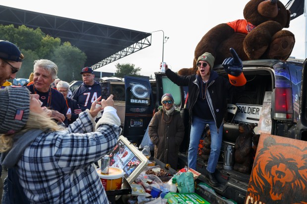 Hailey Grabowski, right, poses for her mother, Anne Grabowski, outside...