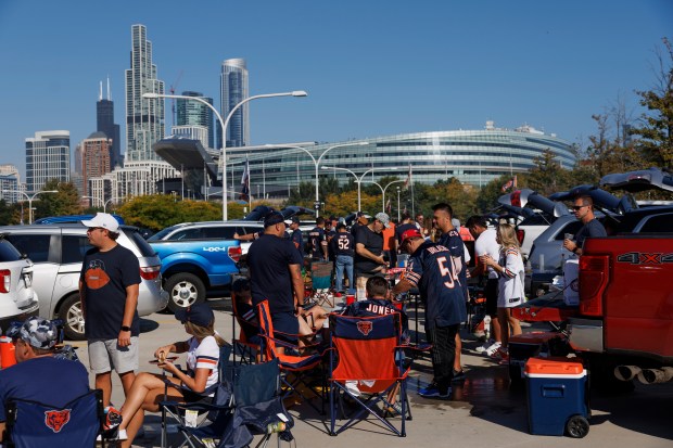 Fans tailgate before the Chicago Bears play the Denver Broncos...