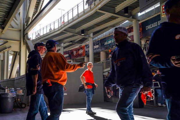 Fans walk through the concourse before the Chicago Bears play...