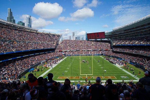 Fans watch as players take the field before the Chicago...