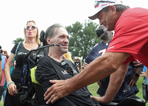 Former Bears players Steve McMichael and Dan Hampton talk before the ALS Walk for Life at Soldier Field on Sept. 18, 2021. McMichael received the Les Turner ALS Foundation Courage Award during the opening ceremony. (John J. Kim/Chicago Tribune)