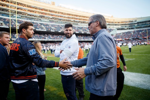 Former Bears quarterback Jay Cutler, left, talks with former Bear...