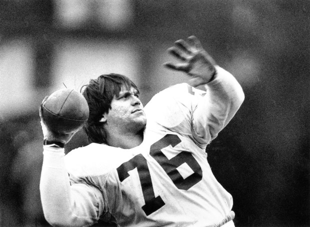 Defensive tackle Steve McMichael as quarterback for the Bears? No,...