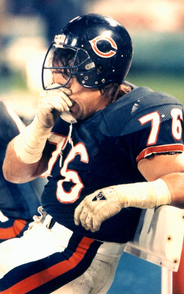 Defensive tackle Steve McMichael takes a breather on the sidelines...