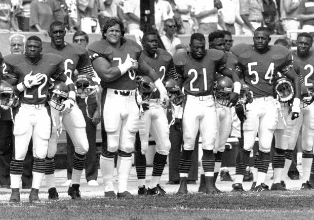 Bears’ defensive tackle Steve McMichael, center, is back and ready...