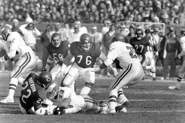 The Eagles’ Anthony Toney runs with the ball, attempting ot...