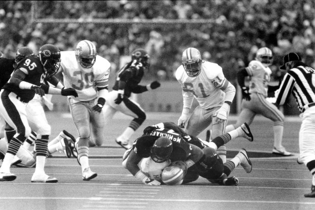 The Bears' Steve McMichael sacks Lions quarterback Eric Hipple on...