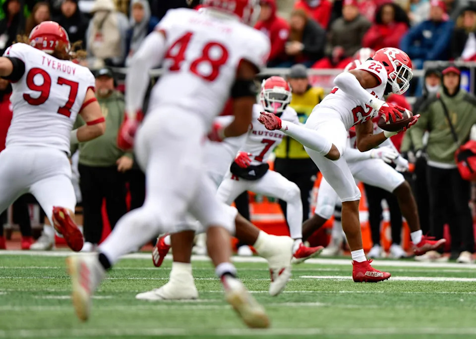 Rutgers Scarlet Knights linebacker Tyreem Powell (22) intercepts a ball against the Indiana Hoosiers. Mandatory Credit: Marc Lebryk-Imagn Images