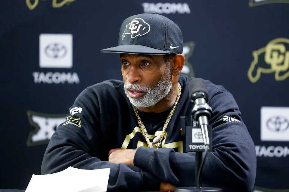 Colorado Buffaloes head coach Deion Sanders speaks during a press conference. Michael Ciaglo-Imagn Images