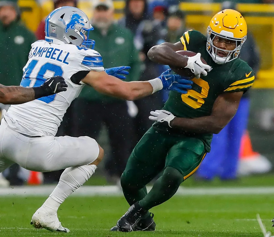 Green Bay Packers running back Josh Jacobs (8) runs the ball against the Detroit Lions on Nov. 3, 2024, at Lambeau Field in Green Bay. The Lions won 24-14 to sweep the season series. The Packers will open the 2025 season against the reigning NFC North champions.