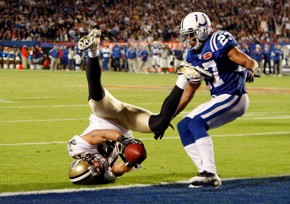 Feb 7, 2010; Miami, FL, USA; New Orleans Saints wide receiver Lance Moore (16) reaches the ball across the goal line against Indianapolis Colts cornerback Jacob Lacey (27) for a two-point conversion during the fourth quarter of Super Bowl XLIV at Sun Life Stadium. Mandatory Credit: John David Mercer-USA TODAY Sports