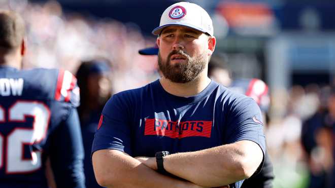 New England Patriots center David Andrews on the sidelines during a game between the New England Patriots and the Miami Dolphins on October 6, 2024, at Gillette Stadium in Foxborough, Massachusetts.