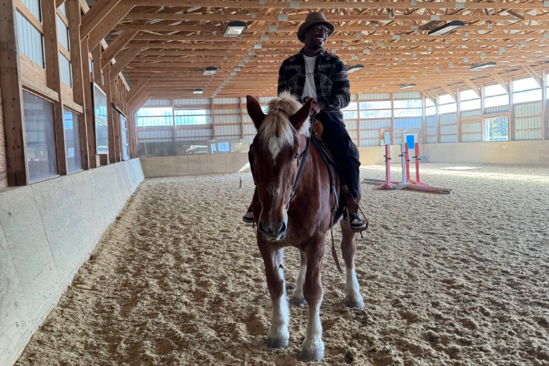 Vernon Davis riding a horse